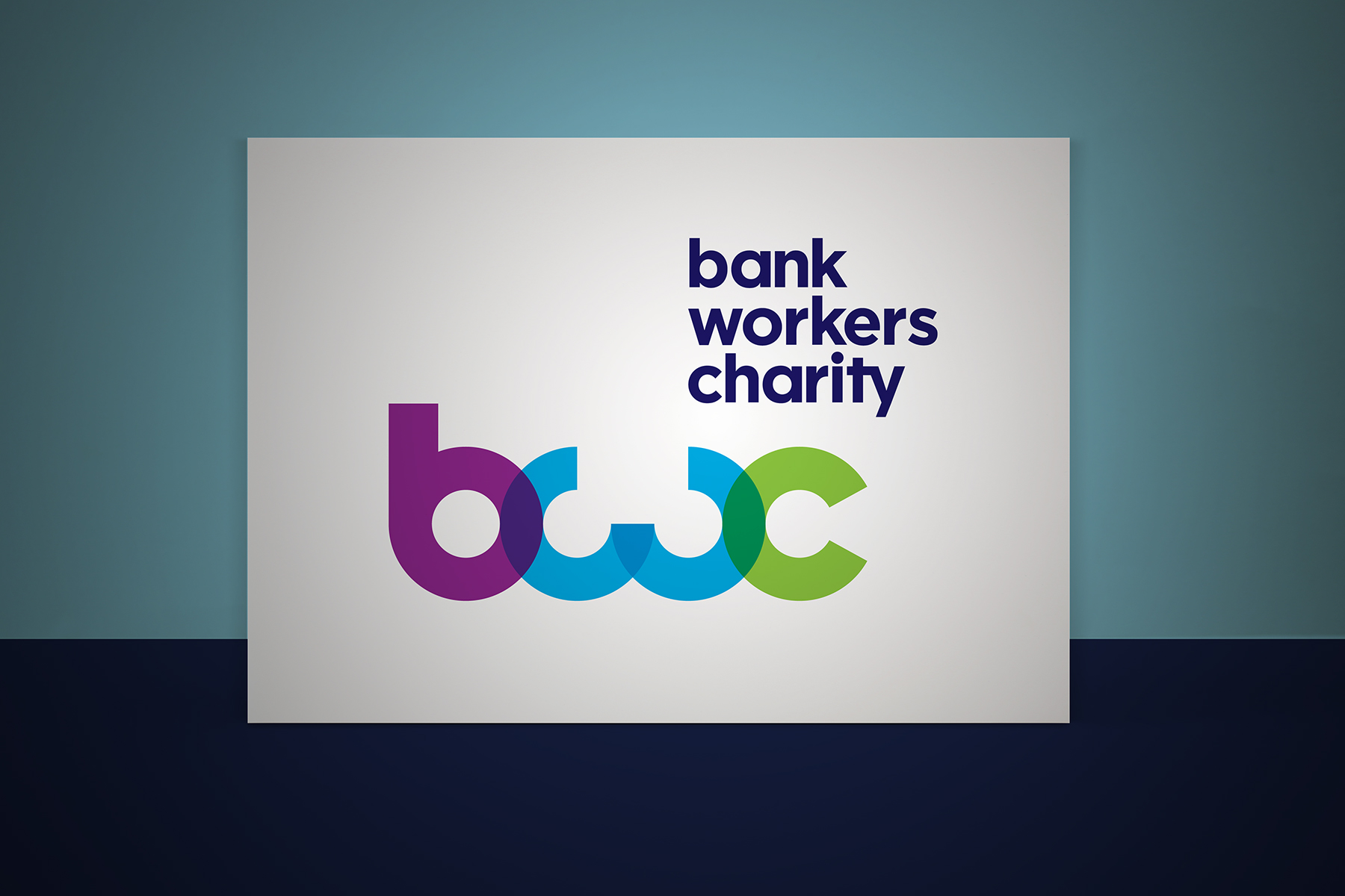The Bank Workers Charity brand mark is constructed purely out of circular shapes. The transparency and colour creates a modern yet approachable feel.