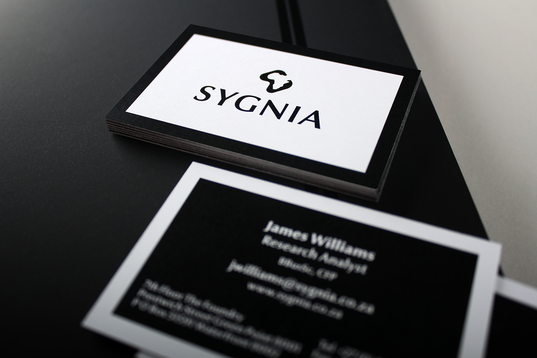At a high level, the corporate identity reverts to a more minimal feel, with an emphasis on quality print and materials.